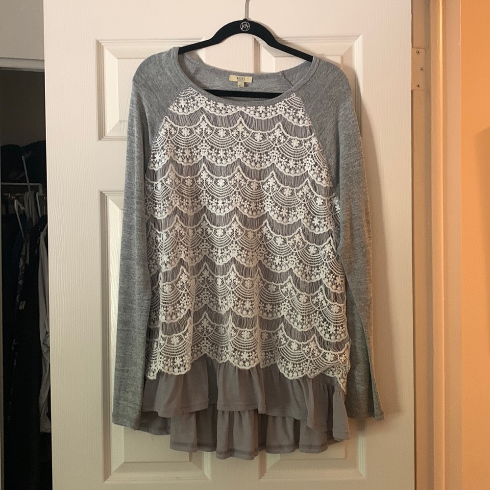 Peplum-style long sleeve blouse